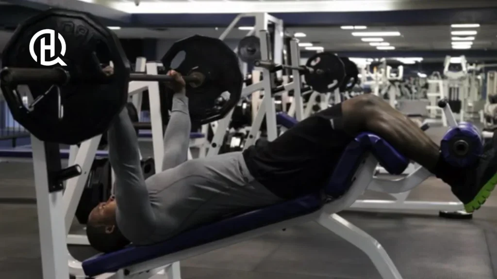 Black man in gym clothes doing decline barbell bench press