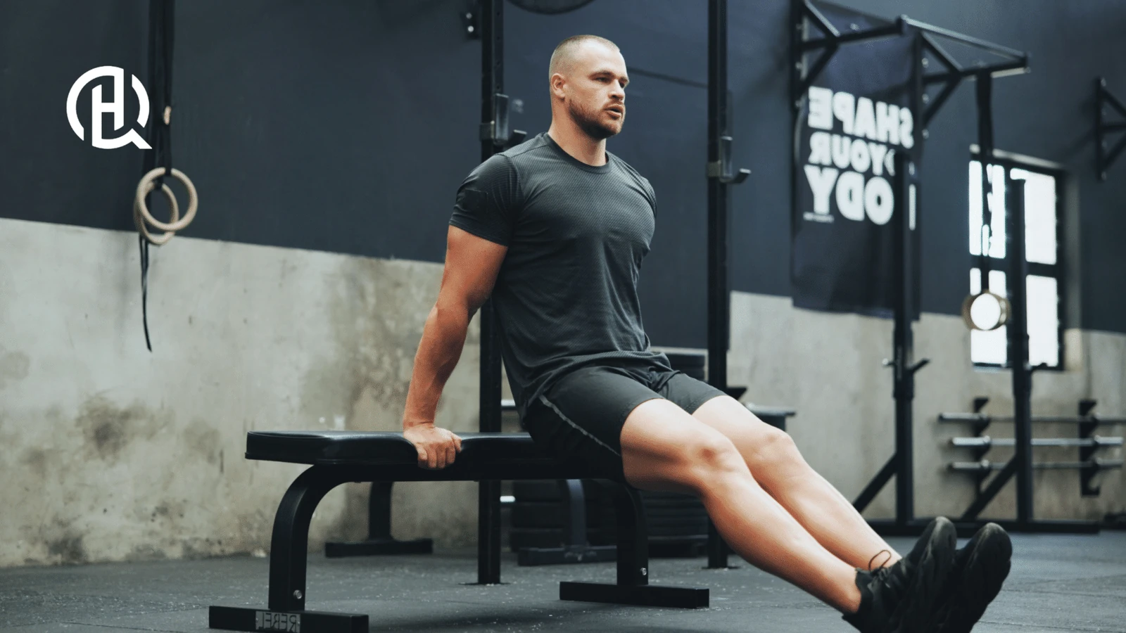 Man doing Bench Dips facing the camera