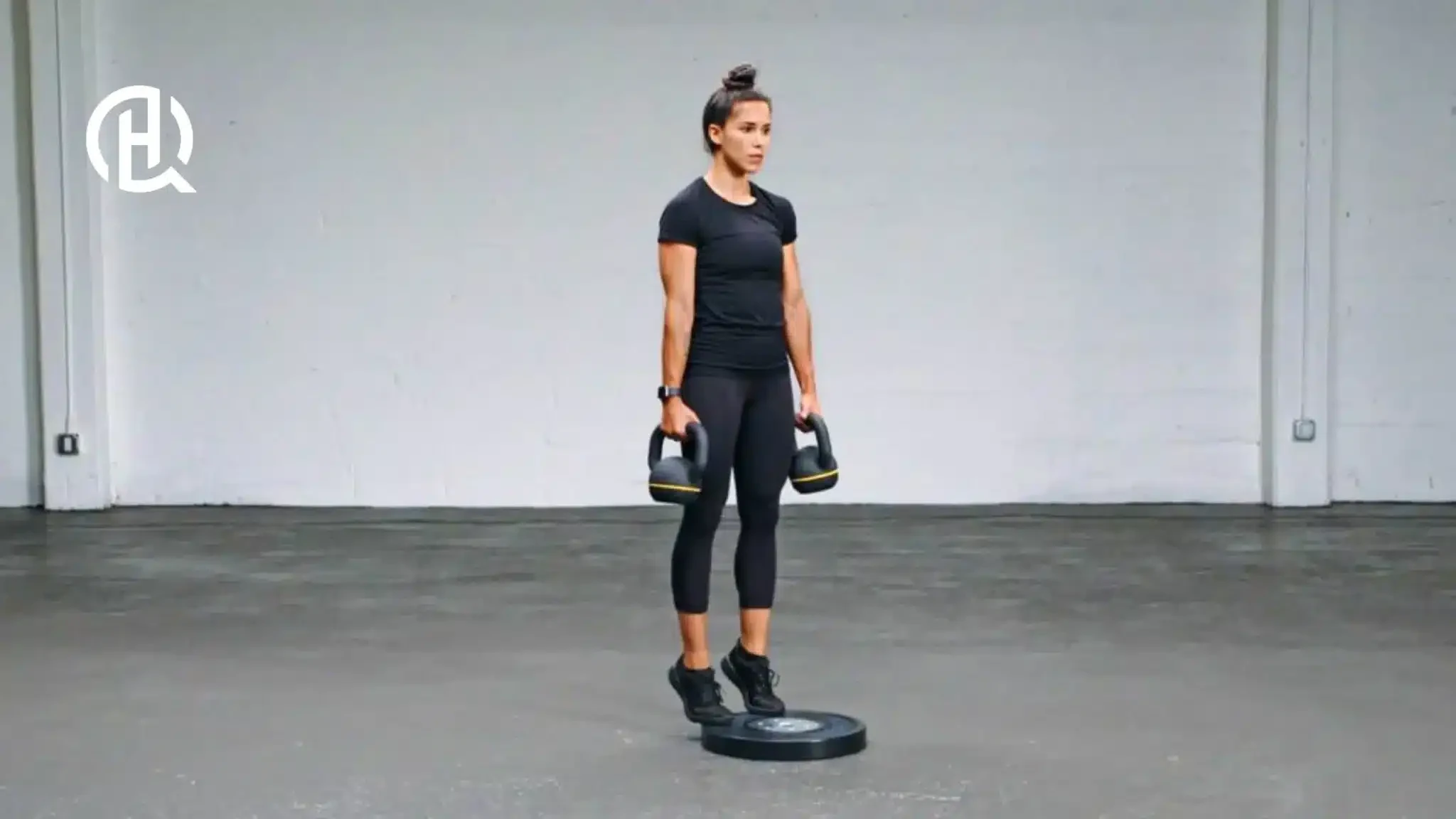 A woman doing a calf raise