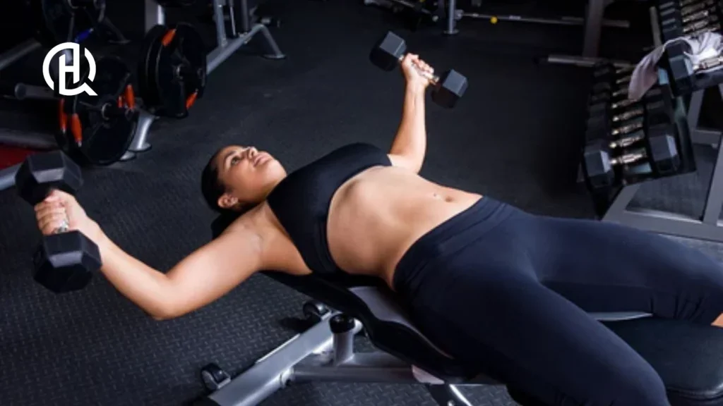 Girl doing barbell fly