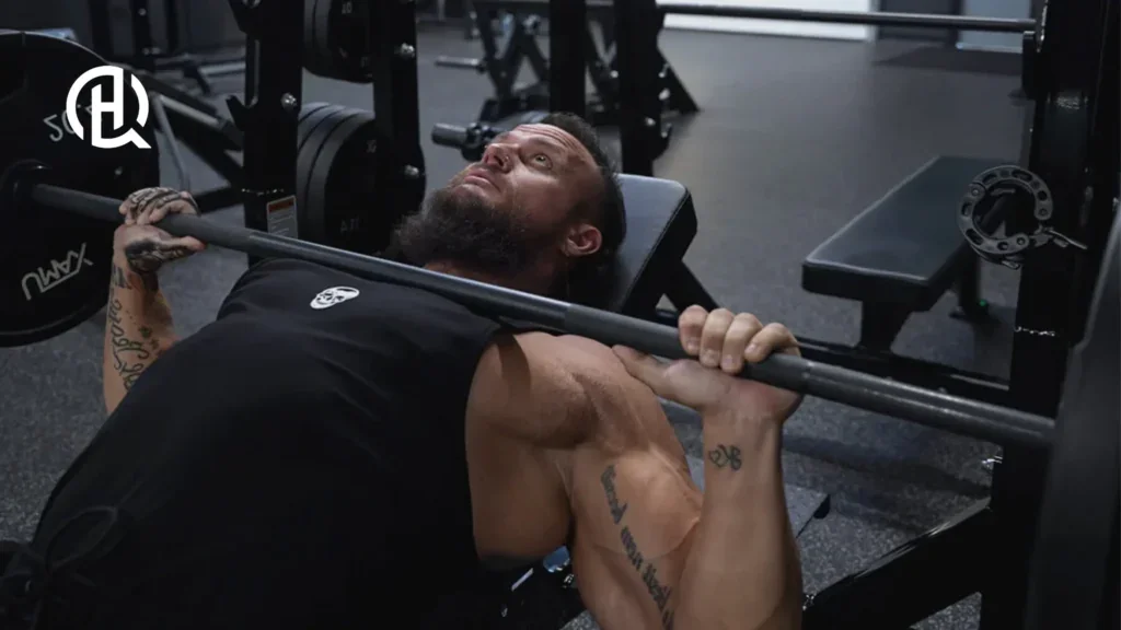 Bearded man doing incline dumbbell bench press
