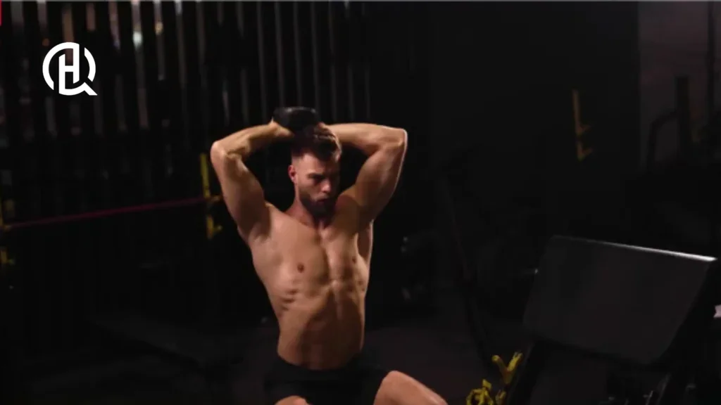 Topless man doing Dumbbell Overhead Triceps Extension