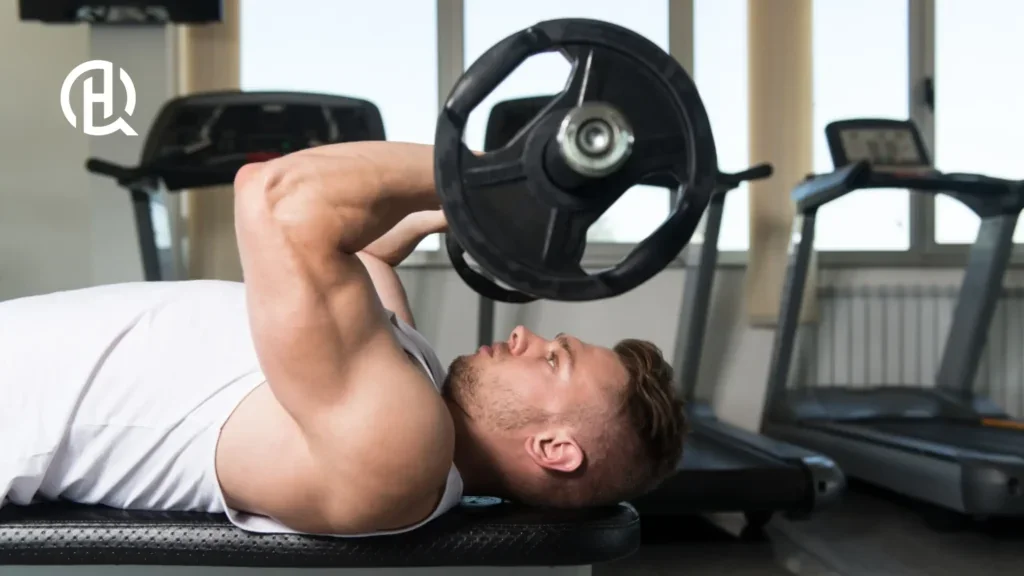 Man in white sando doing Lying Triceps Extension