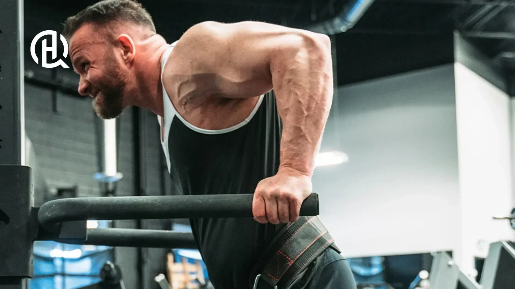 Man doing dips in deep stretch on straight bars