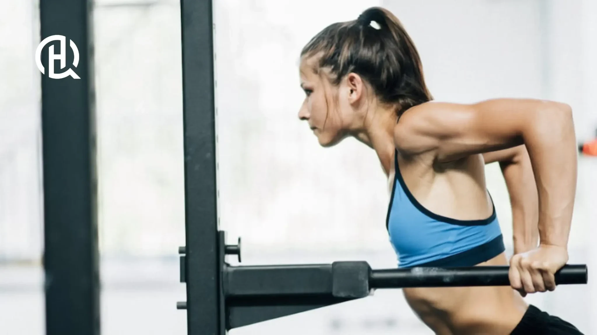 Woman performing dips on straight bars