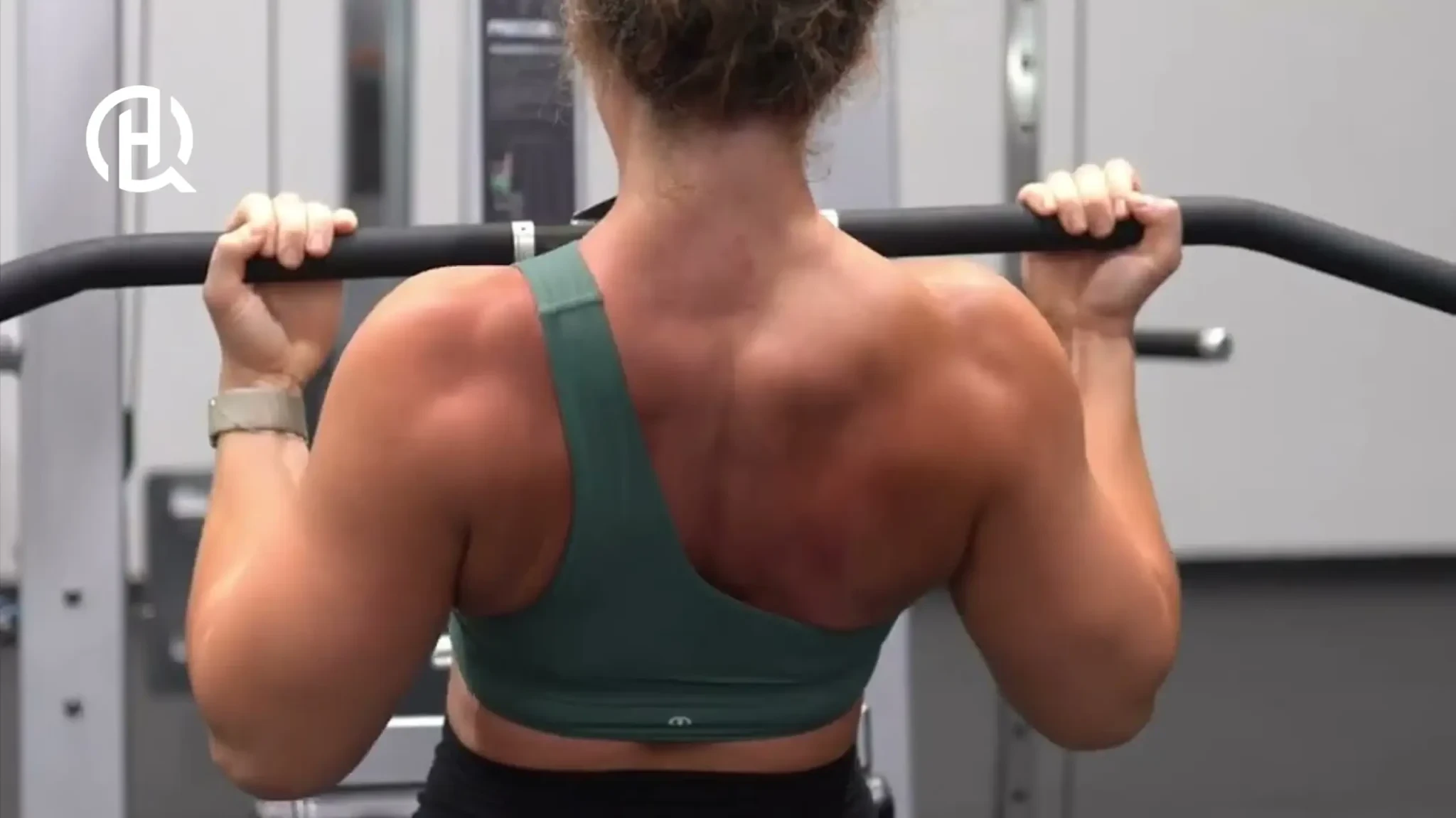 Woman doing reverse grip pulldown with proper breathing