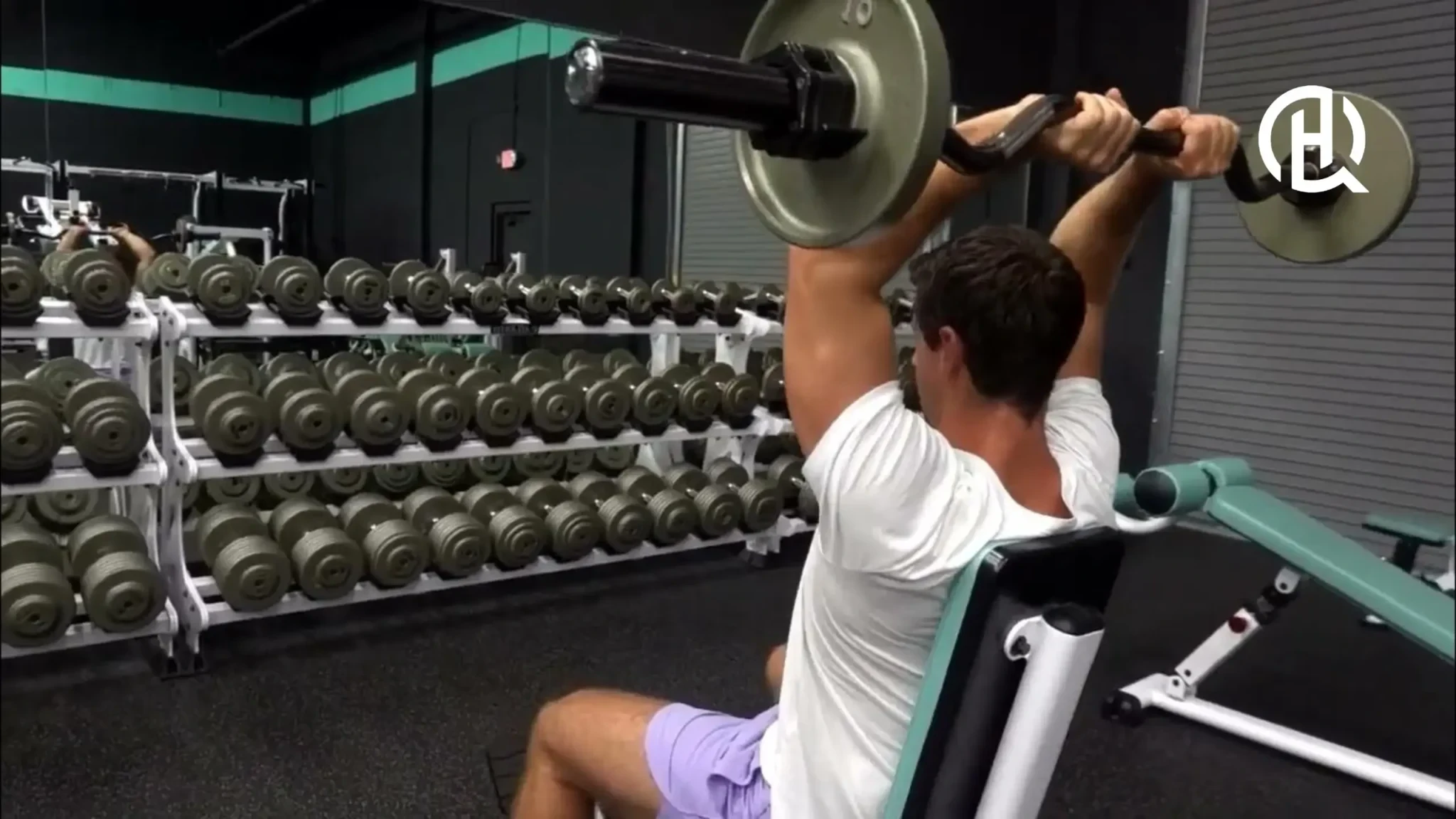 Man doing Seated Barbell French Press with back support
