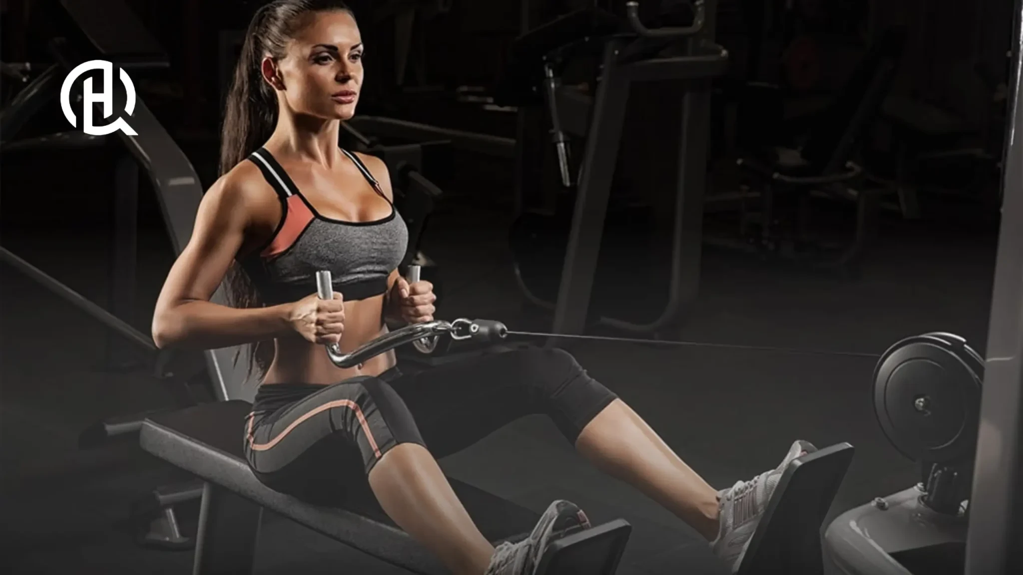 Woman performing seated cable row facing camera