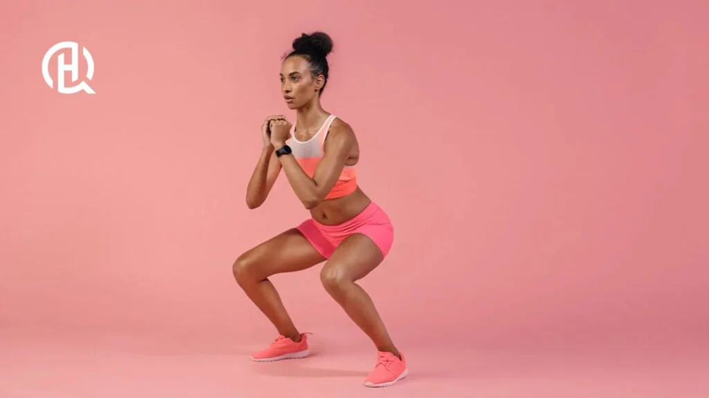 A woman doing body weight squats