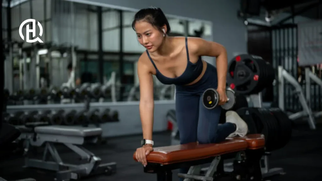 A girl doing triceps kickback