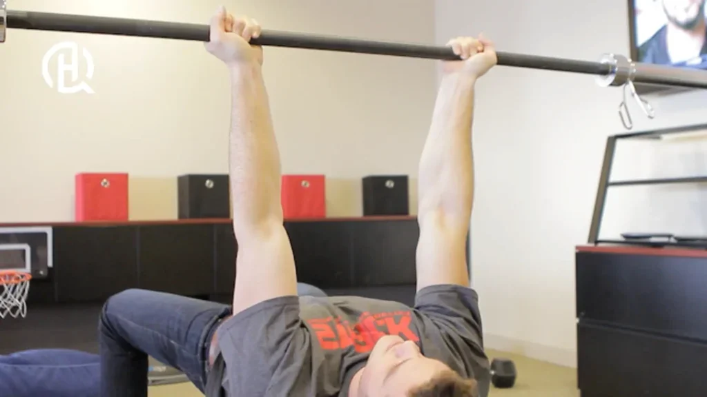 Man demonstrating reverse grip barbell