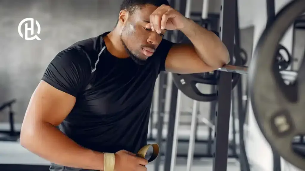 A man being sweaty posing for the camera