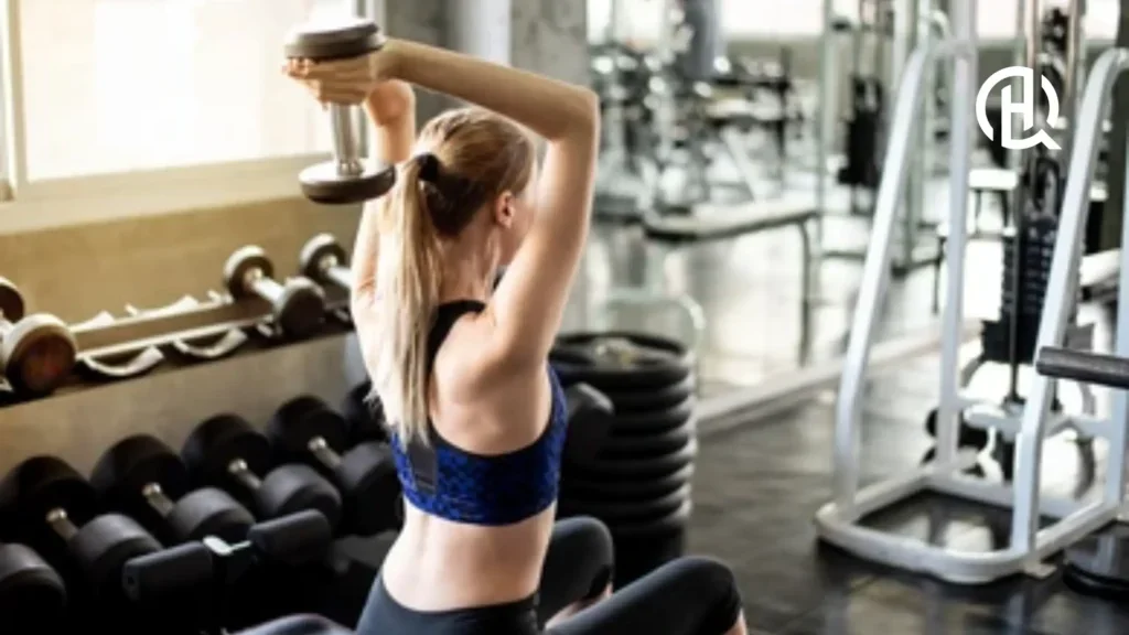 Girl doing dumbbell overhead extension