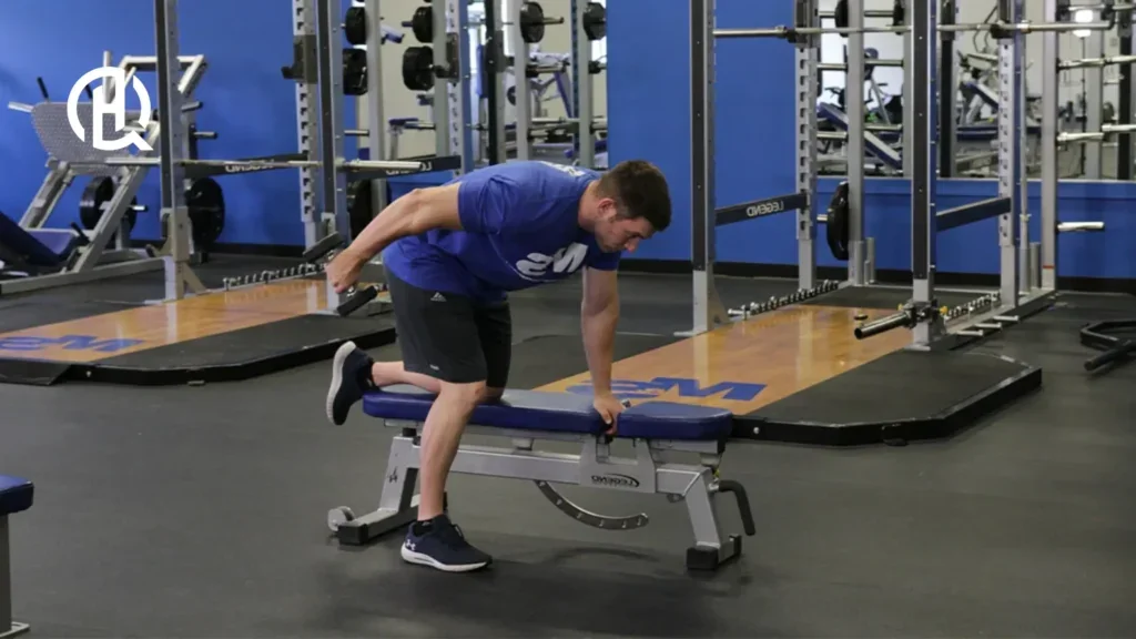 Man showing how to do the tricep kickback