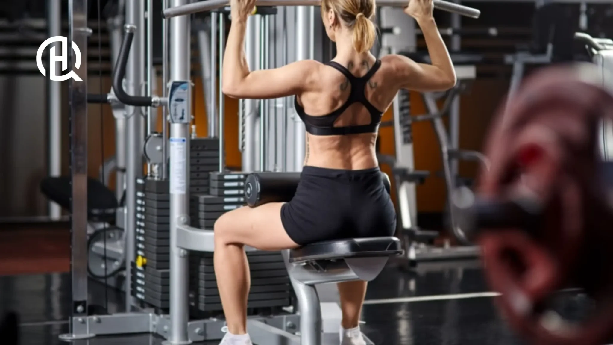 Woman demonstrating controlled ascent on lat pulldown